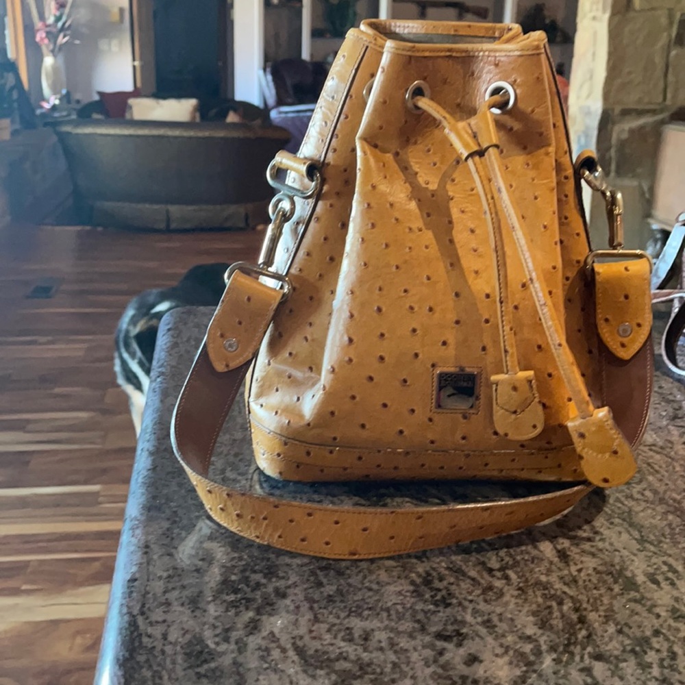 Tan ostrich print D & B bag
